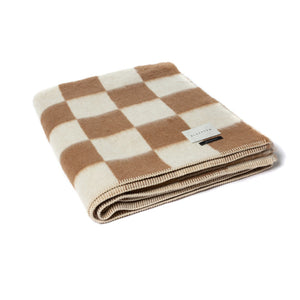 The Blacksaw Checkerboard Crosby Blanket in Tabacco Brown, folded product shot with beautiful Blanket Stitching