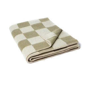 The Blacksaw Checkerboard Crosby Blanket in Boa Green folded product shot with beautiful Blanket Stitching