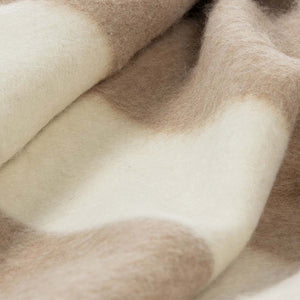 The Blacksaw 100% Recycled Siempre Blanket in Beige with Ivory StripeClose Up product shot showing beautiful Blanket Stitching