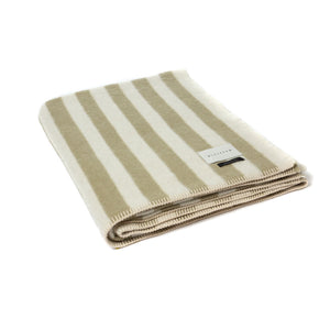The Blacksaw Stills Vertical Stripe Blanket in Boa Green, folded product shot with beautiful Blanket Stitching and branded label
