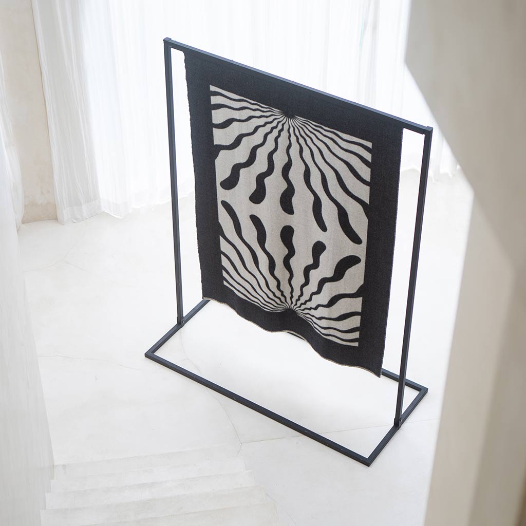 The Blacksaw Dopamine Psychedelic Art Blanket in Black/Ivory Flat laying product shot