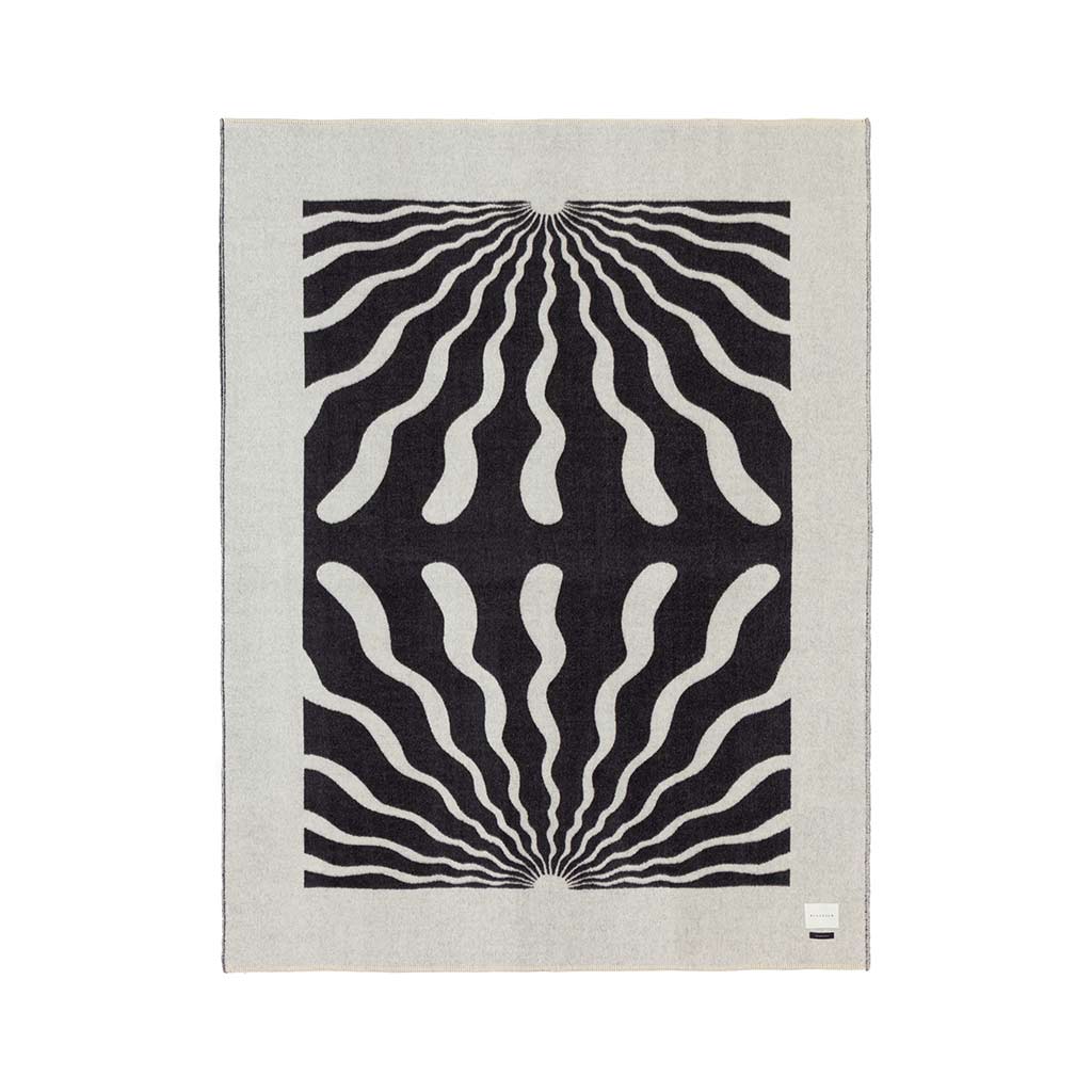 The Blacksaw Dopamine Psychedelic Art Blanket in Black/Ivory Flat laying product shot