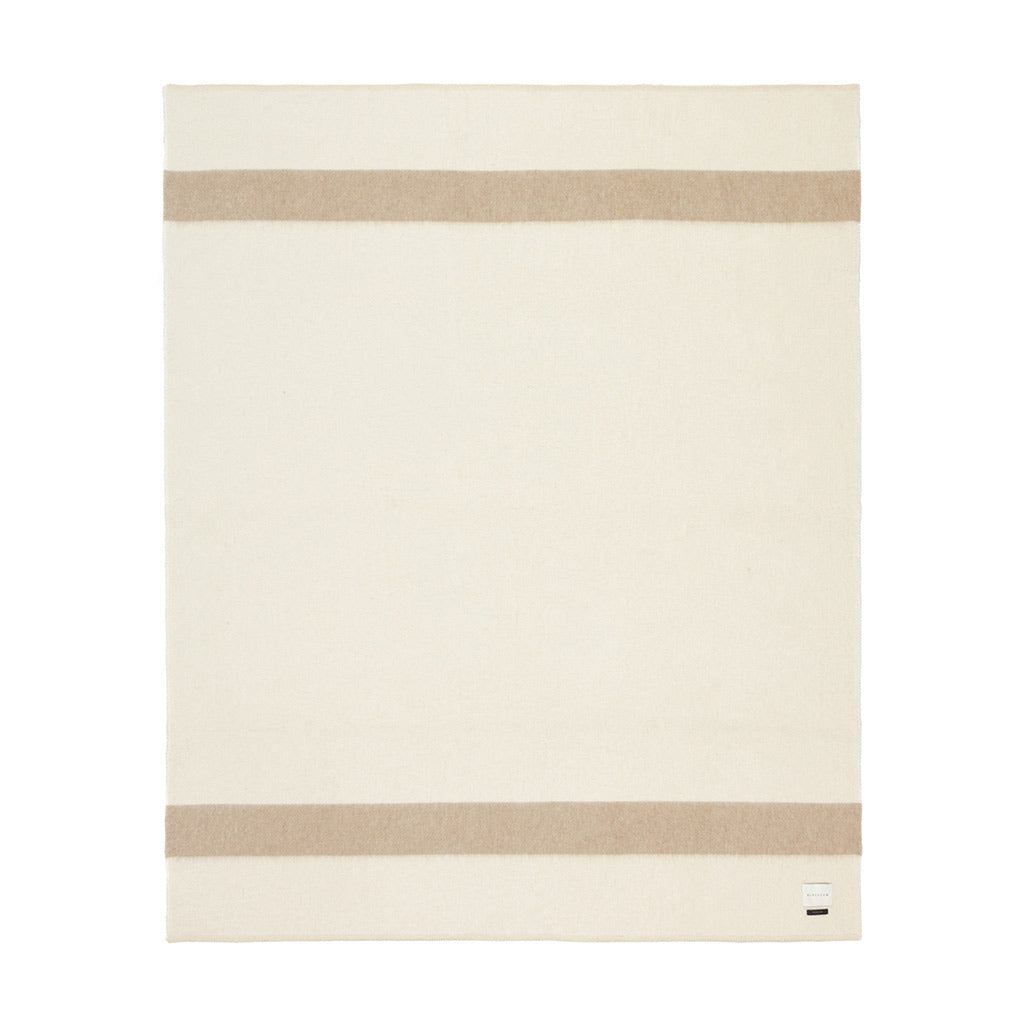 The Blacksaw 100% Recycled Siempre Blanket  laying flat in Ivory with Beige Stripe 