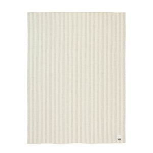 The Blacksaw Stills Vertical Stripe Blanket in Shoji Beige/Ivory Flat laying product shot