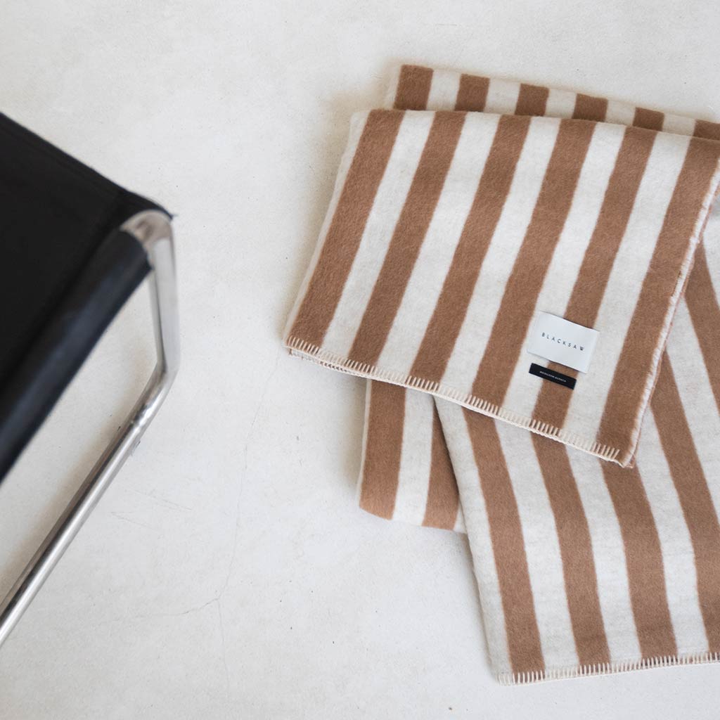 The Blacksaw Stills Vertical Stripe Blanket in Tabacco Brown, Flat laying product shot