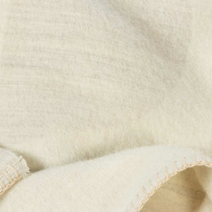 The Blacksaw 100% Alpaca, Reversible TimeWarp Throw Blanket in  Zero Dye Ivory & Shoji Close Up product shot showing beautiful Blanket Stitching