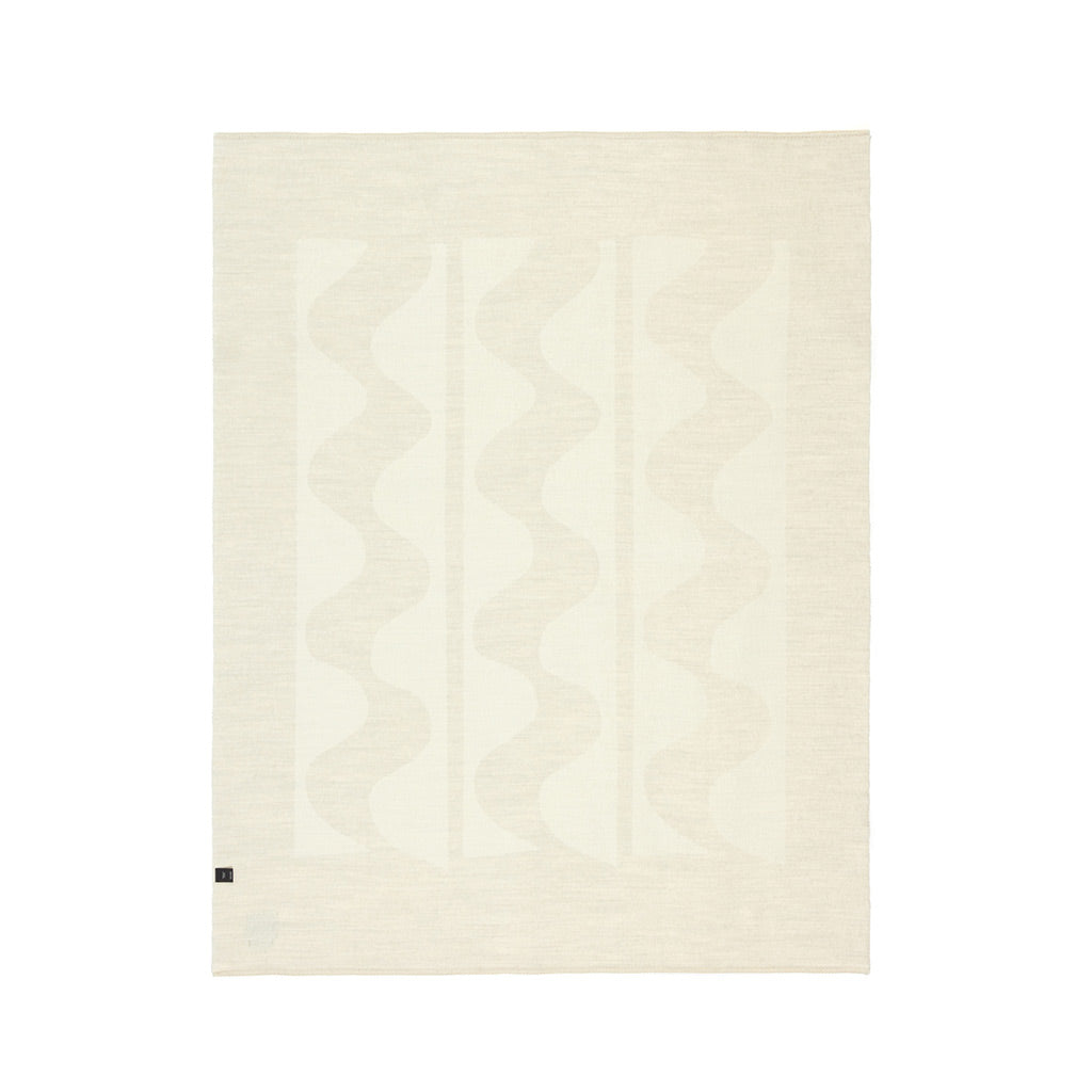 The Blacksaw 100% Alpaca, Reversible TimeWarp Throw Blanket laying flat in Zero Dye Ivory & Shoji. Reverse Side